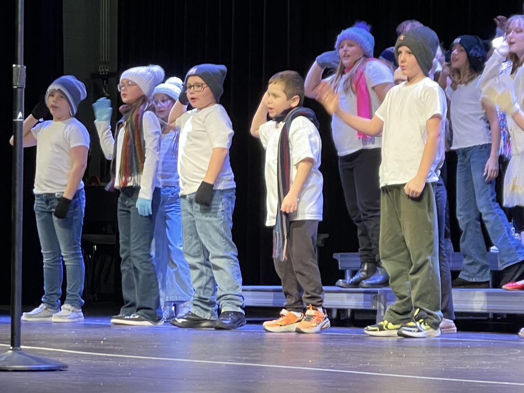 Students performing on a stage