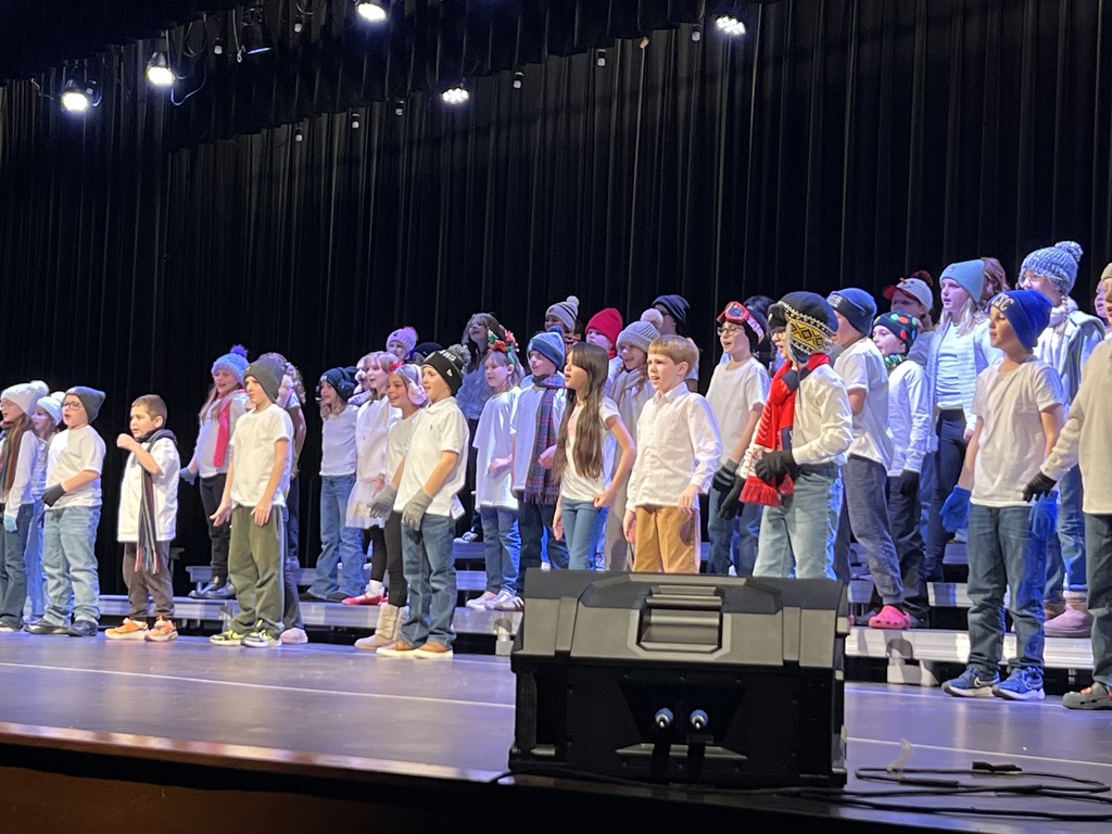 Students performing on a stage