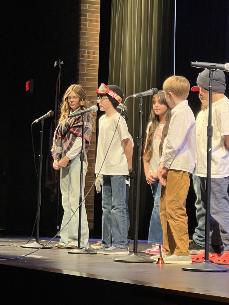 Students performing on a stage