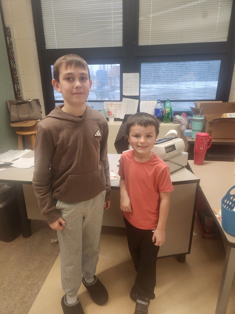 students helping out with a Santa shop at a school