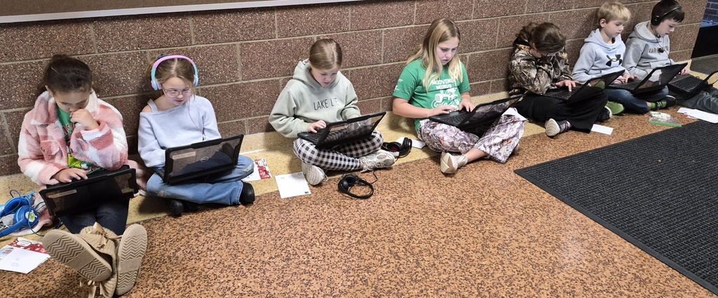 Students practicing their Math while sitting in the hall
