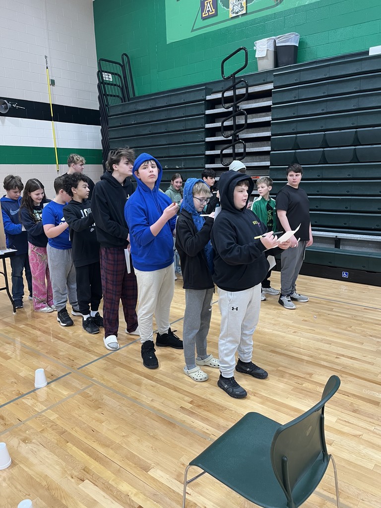 students presenting in a gym