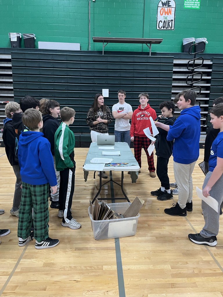 students presenting in a gym