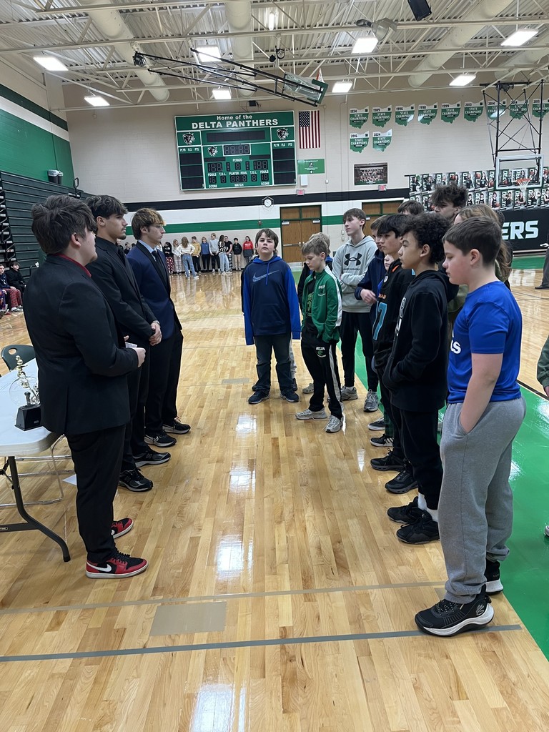 students presenting in a gym