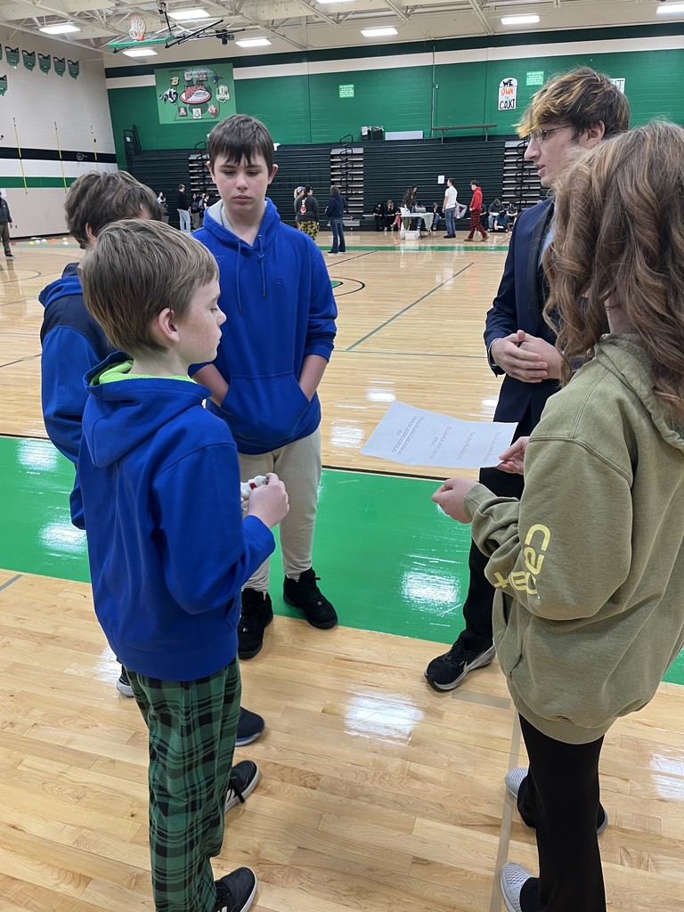 students presenting in a gym