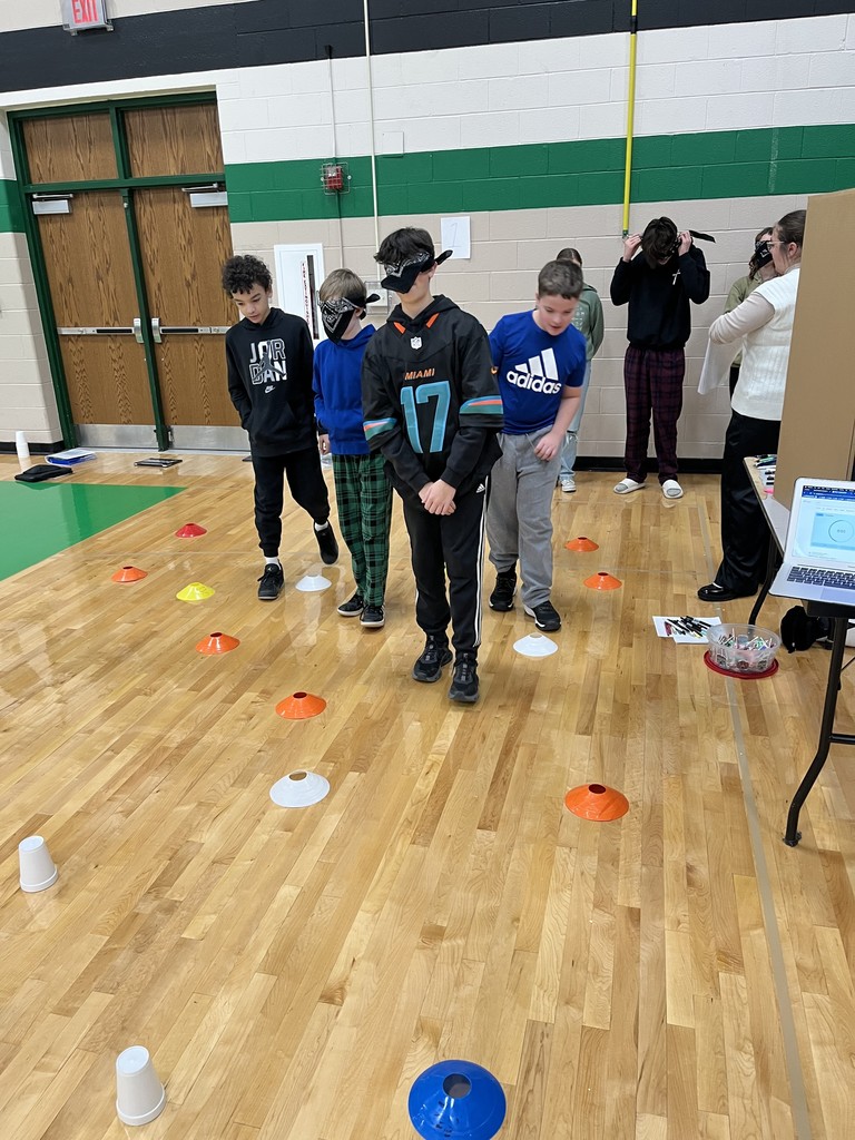 students presenting in a gym