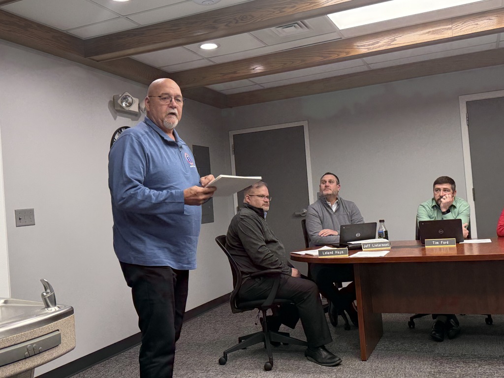 a man presenting an award