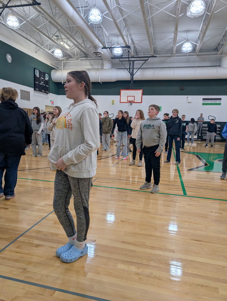 middle school students playing in a gym