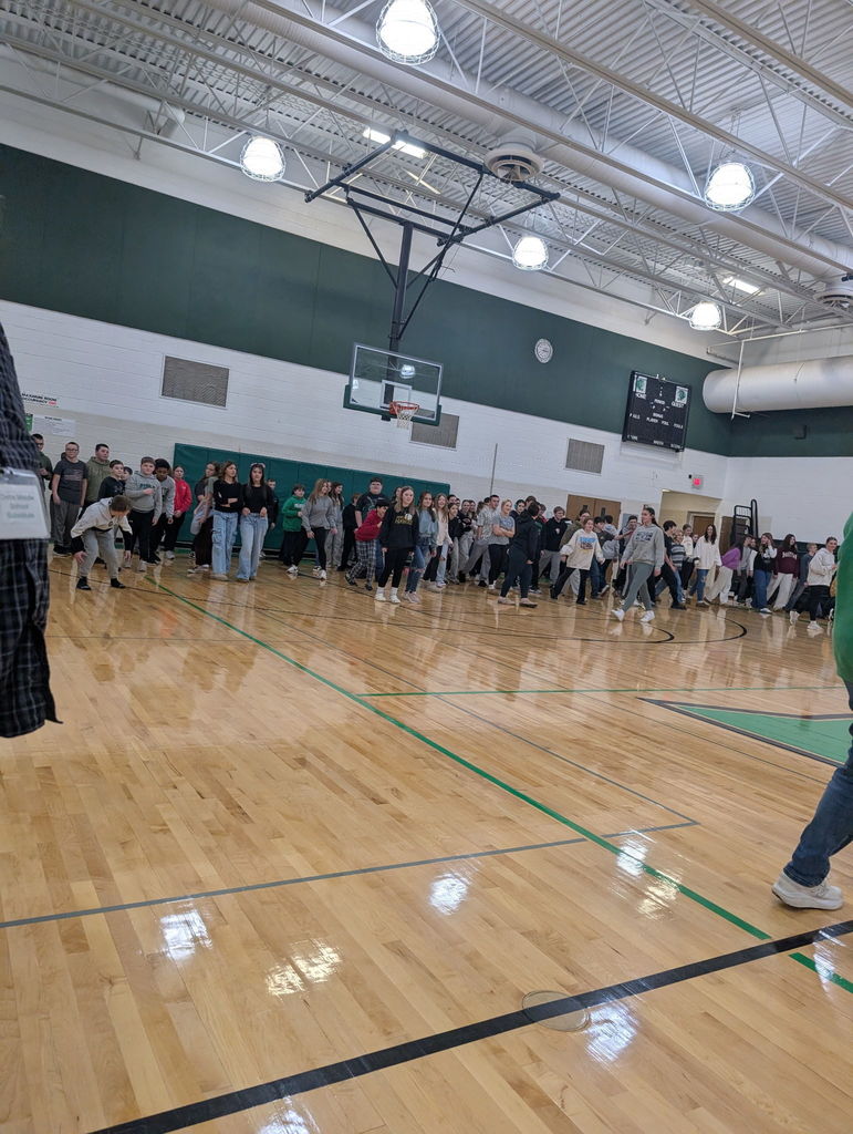 middle school students playing in a gym