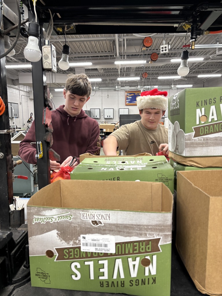 students putting together fruit baskets