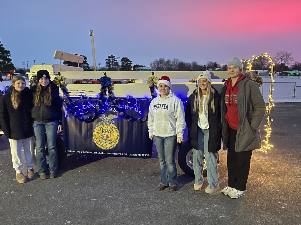 Students sitting on a float in a parade