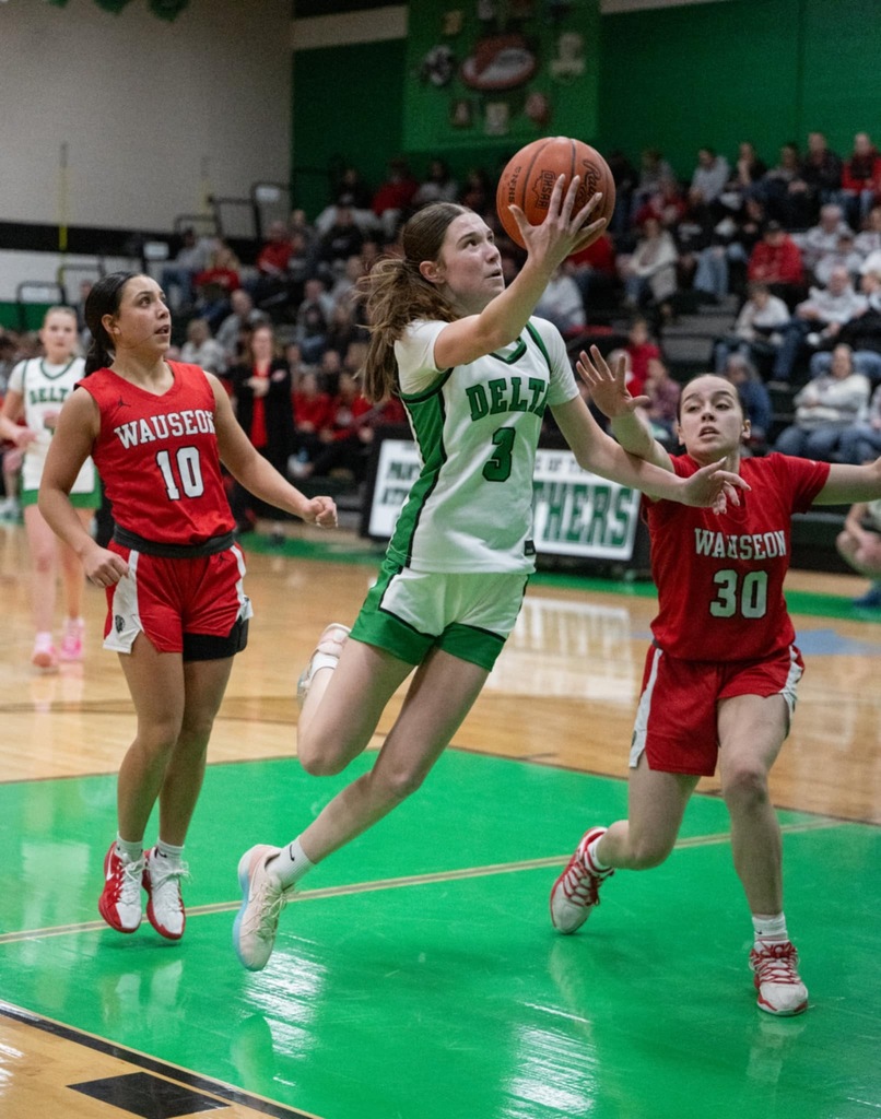A student making a basketball hoop