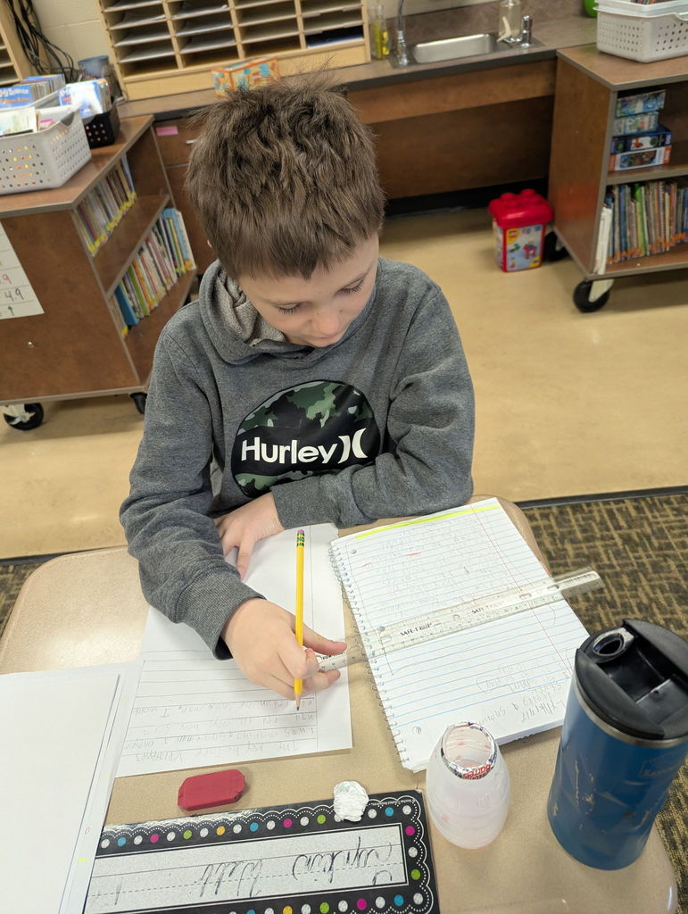 Students writing in a classroom