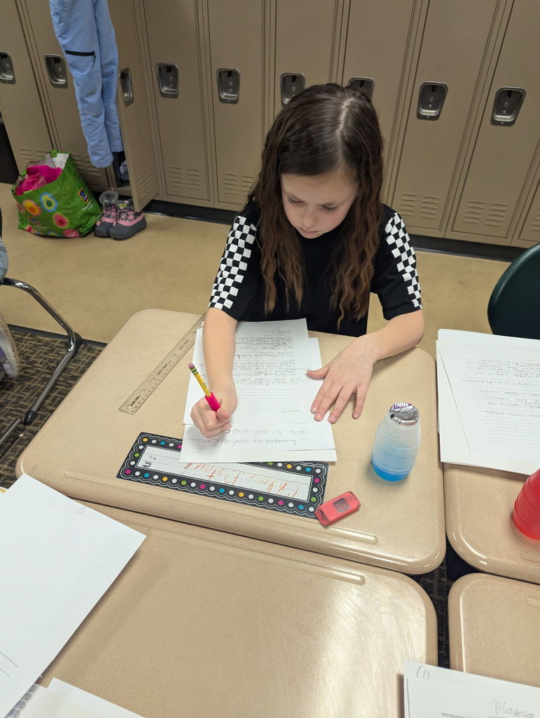 Students writing in a classroom
