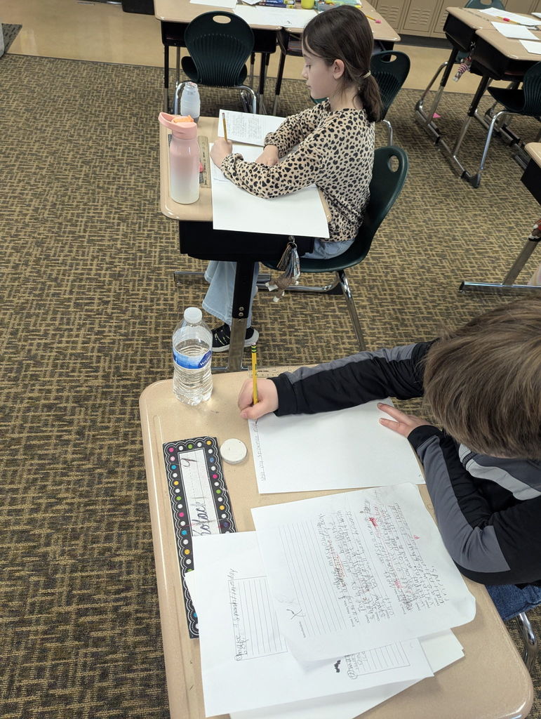 Students writing in a classroom
