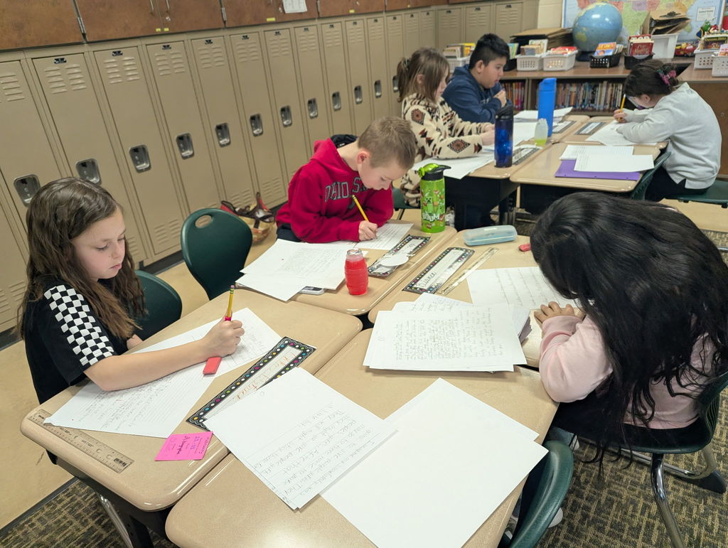 Students writing in a classroom