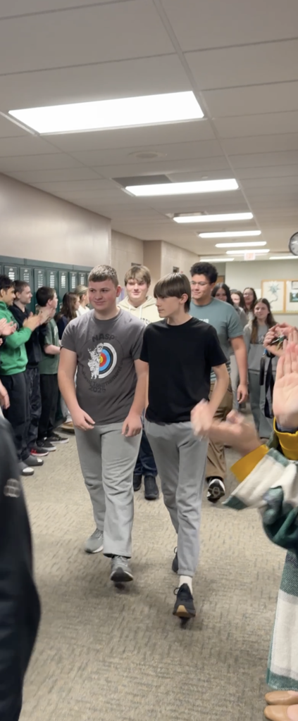 Archery members walking in the hall