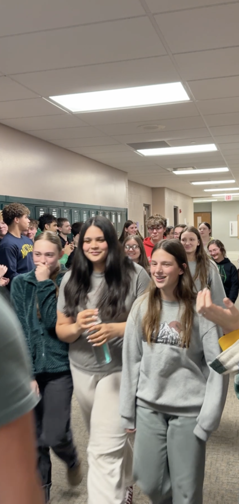 Archery members walking in the hall