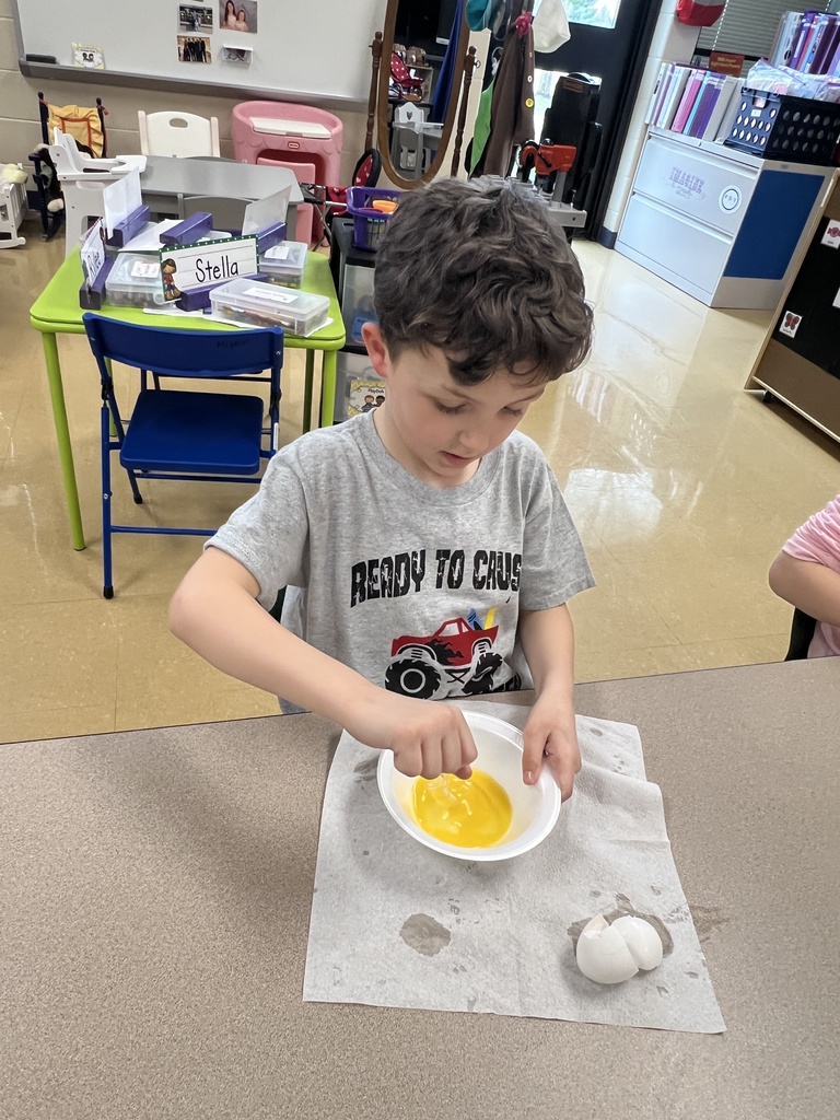 A student eating green eggs and ham
