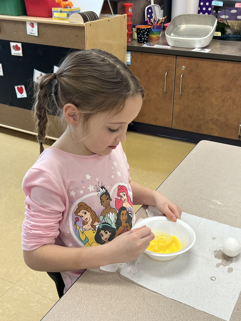 A student eating green eggs and ham