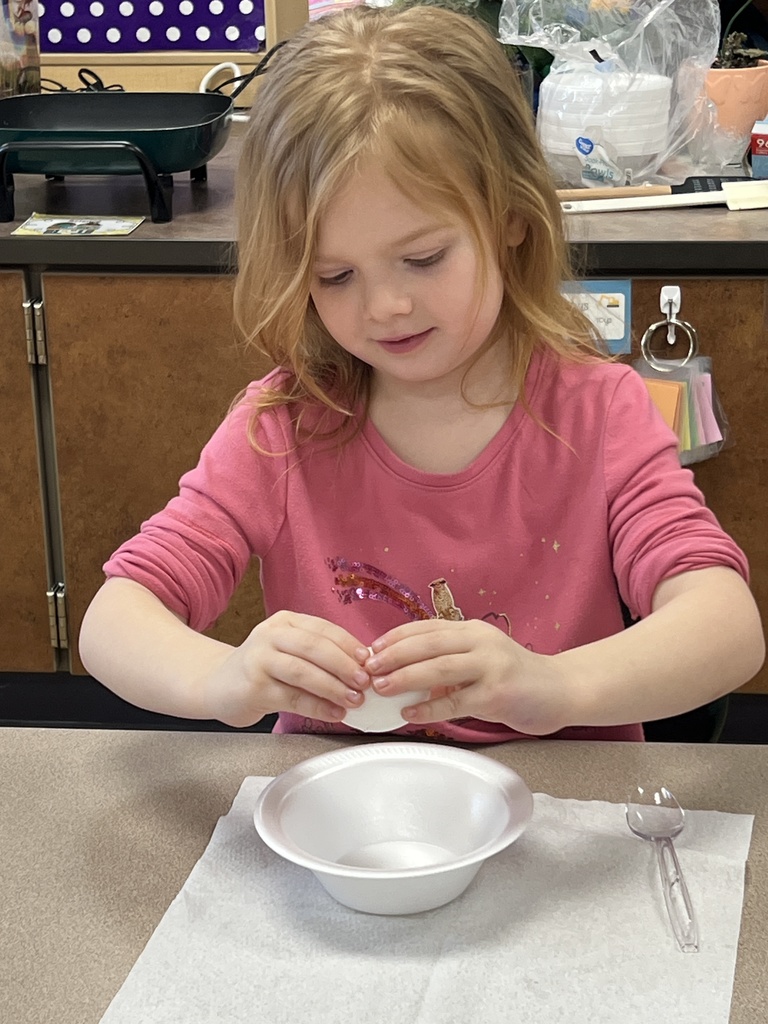 A student eating green eggs and ham