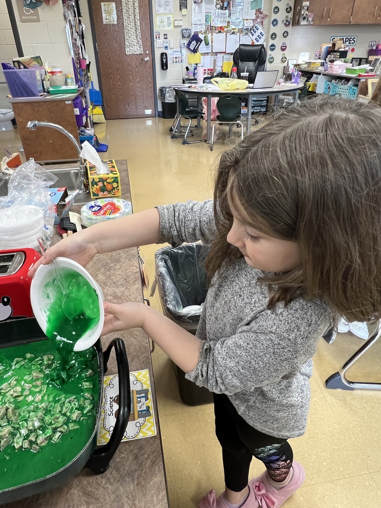 A student eating green eggs and ham