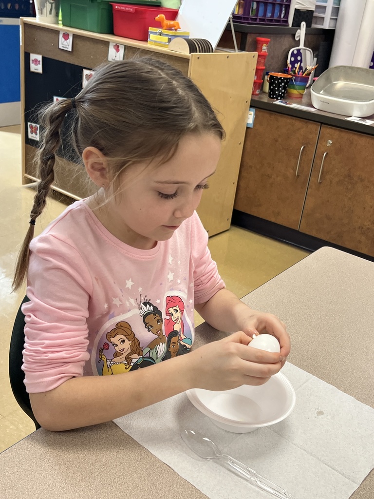 a student making green eggs and ham