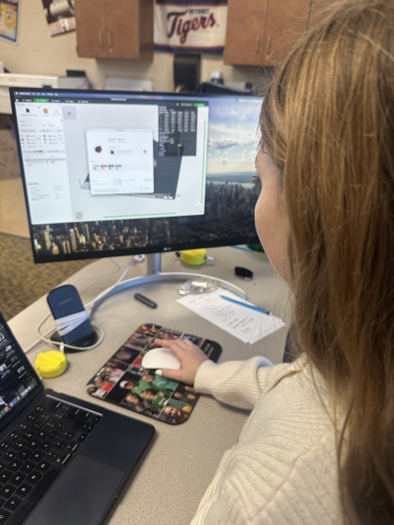 A student designing on a computer