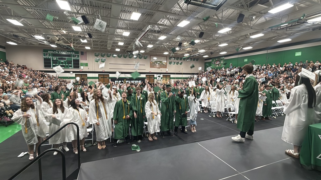 Seniors throwing their hats in the air