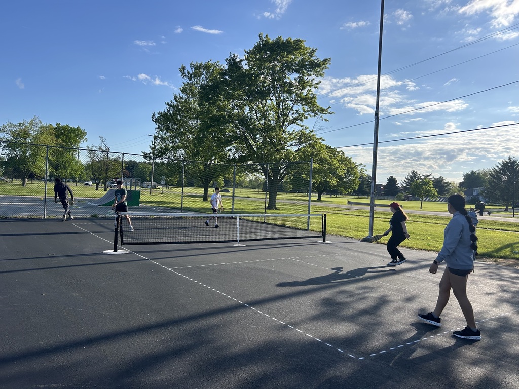 Students playing on the Pickle Ball courts