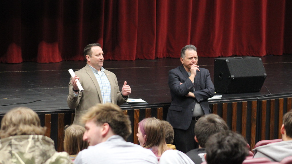 Both Senators talking to students.