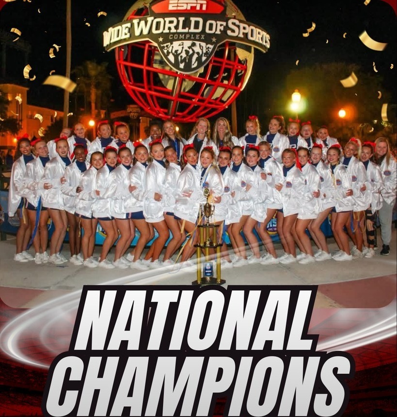 Picture of cheerleaders in white National Champions jackets in front of the ESPN Wide World of Sports 