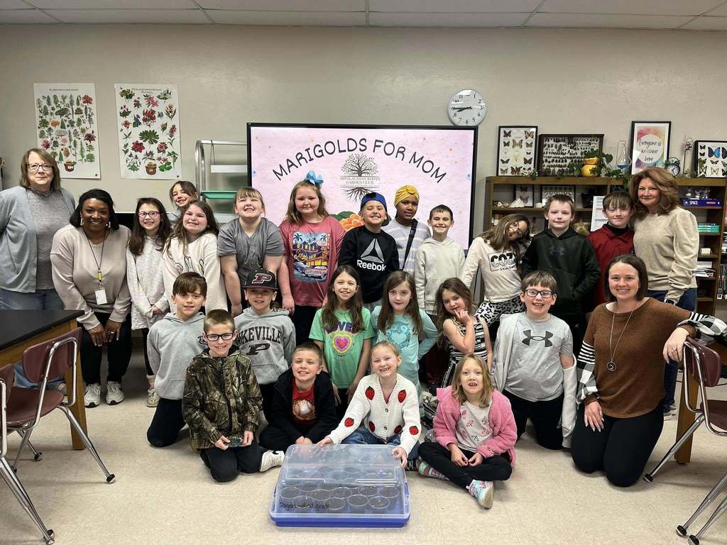Members of the Appalachian Garden Club of Pikeville assist students with Marigolds for Mom!