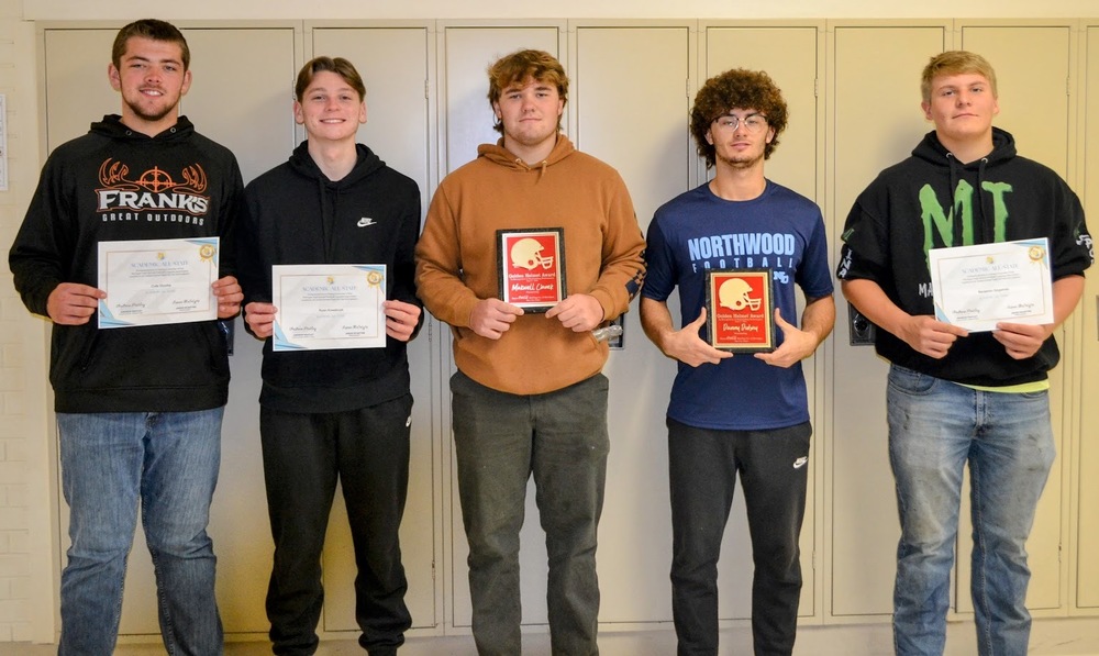 5 football players with thier awards