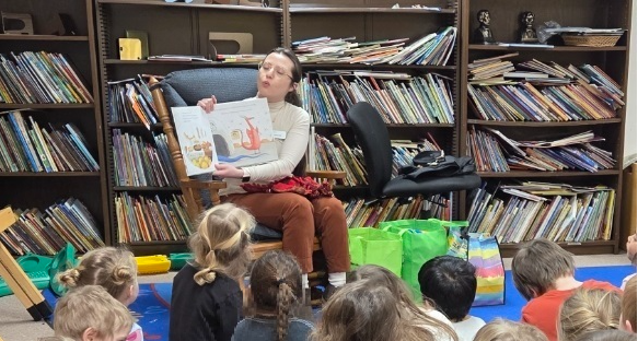 Person reading to students