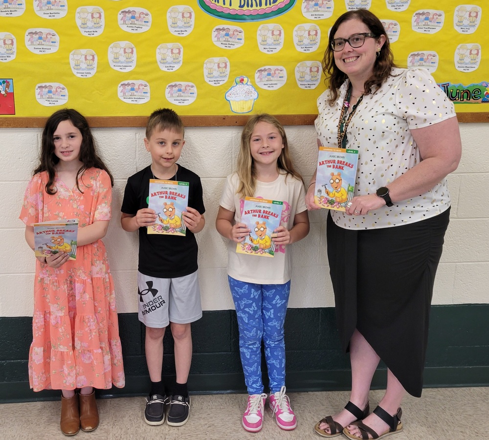 Students holding books