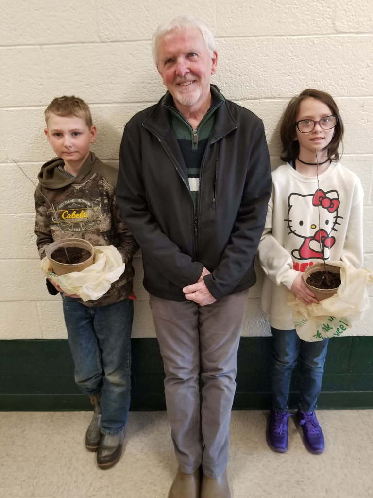 students with sapling
