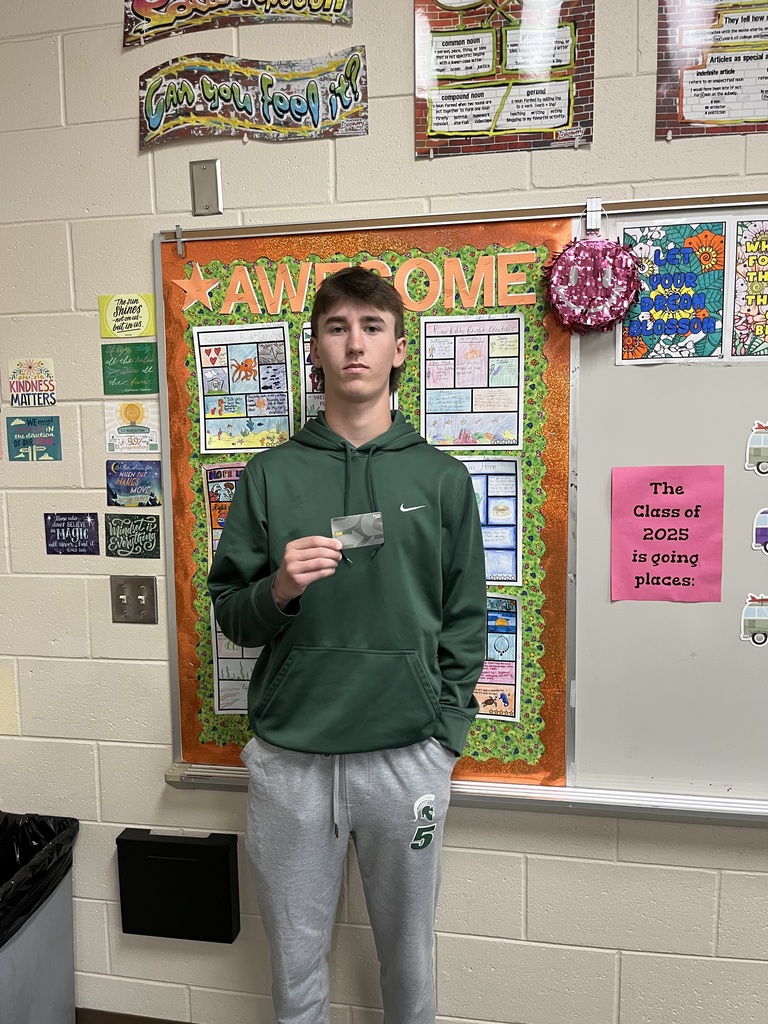 Zach Laures holding a gift card