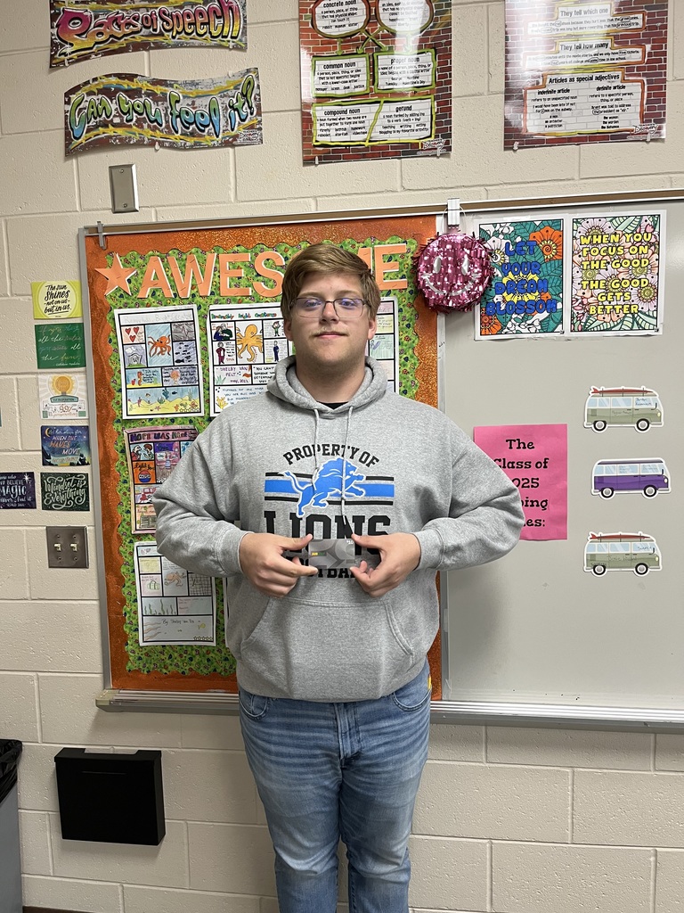 Alan Whiting holding a gift card