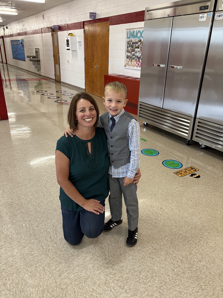 Tara Gwisdala with a student in the hallway