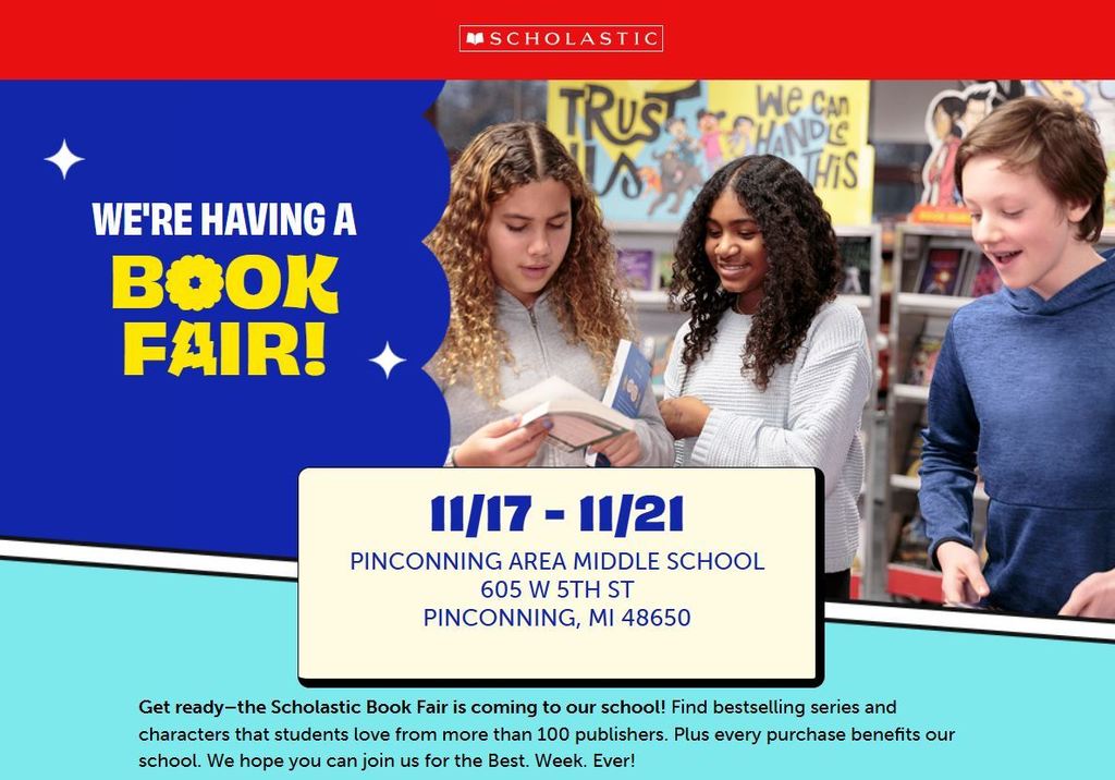three students looking at books available at the book fair