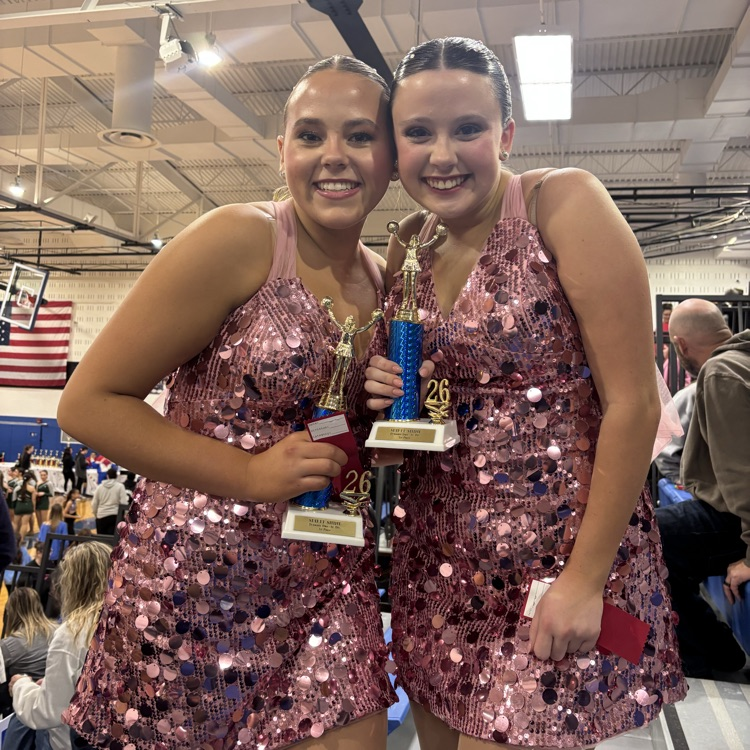 Two dancers with their trophies