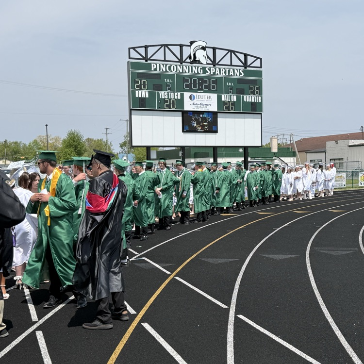 Graduates on the track walking