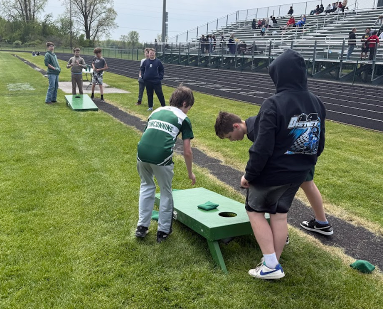 Students playing corn hole