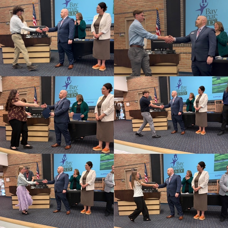 6 students shake hands with principal