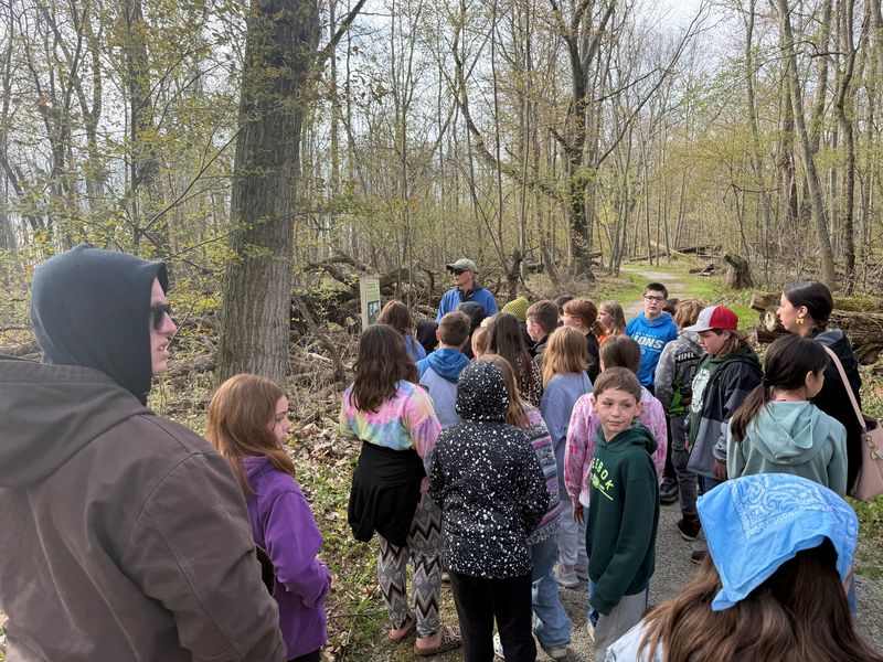 Students listen to a Rotarian