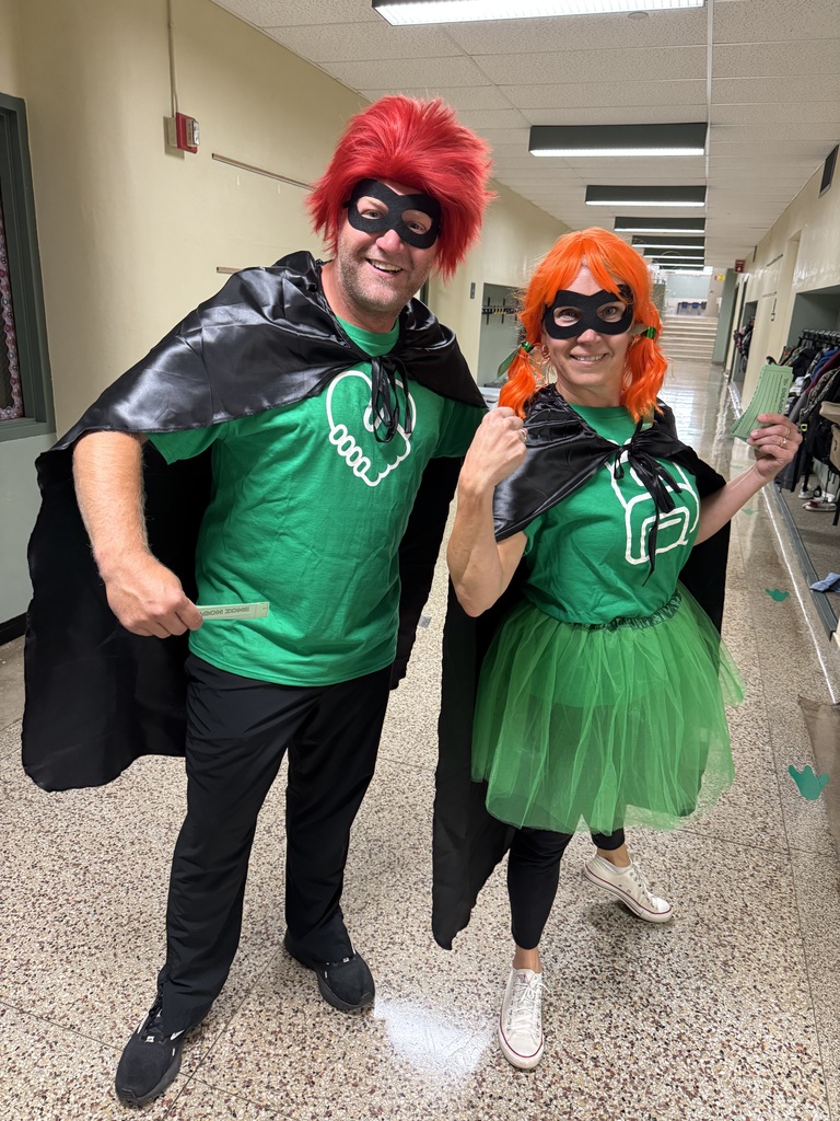Two Pine City educators dress up in superhero costumes