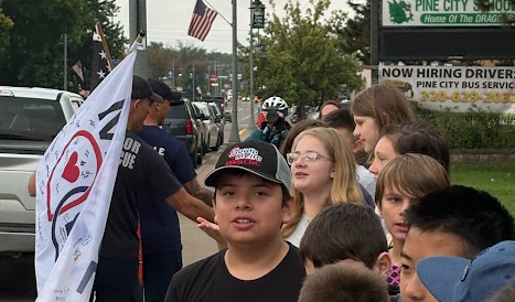 Sixth grades students supporting MN Firefighters on their walk