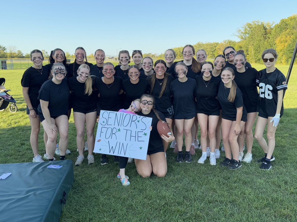 Senior girls for the win sign for the Powerderpuff game at Homecoming 2025 in Pine City.