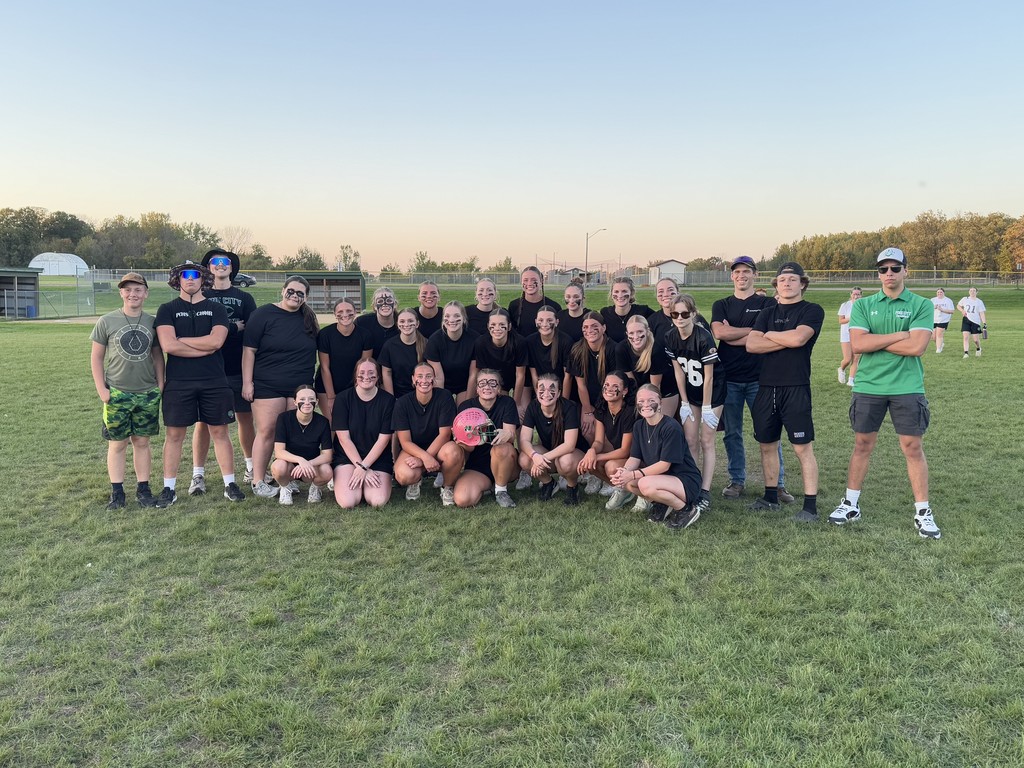 Homecoming Powerpuff game senior girls team in black shirts with coaches 2025